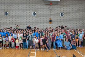 Students and local Anza church members pose for a group