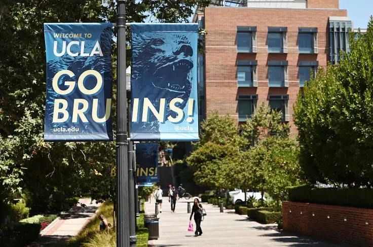 People walk on the UCLA campus on July 30, 2025 in Los Angeles, California. The University of California, Los Angeles has reached a $6 million settlement with Jewish students and a professor in a lawsuit alleging discrimination over the 2024 pro-Palestinian campus protests. Getty Images/Mario Tama